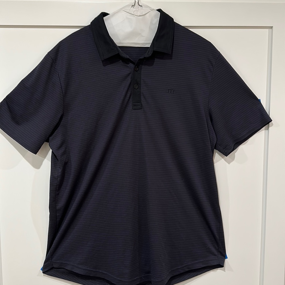 Travis Mathew golf polo size large. Black with thin grey stripes.